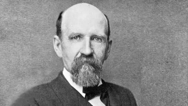 Porträt von Joshua Slocum, dem ersten Einhandsegler, mit Bart und Anzug.